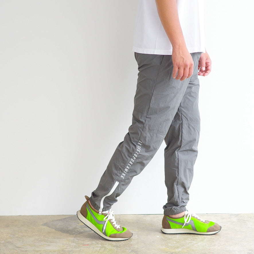 ANORAK CLUB  -LET'S STOP DREAMING-  NYLON TRACK PANTS  アノラッククラブ